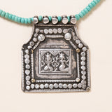 Kingman Turquoise Necklace with Silver Deity Pendant