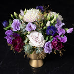 Elegant floral design featuring deep, rich hues in a metallic gold vase, reflecting the luxe quality of our premier Denver flower shop.
