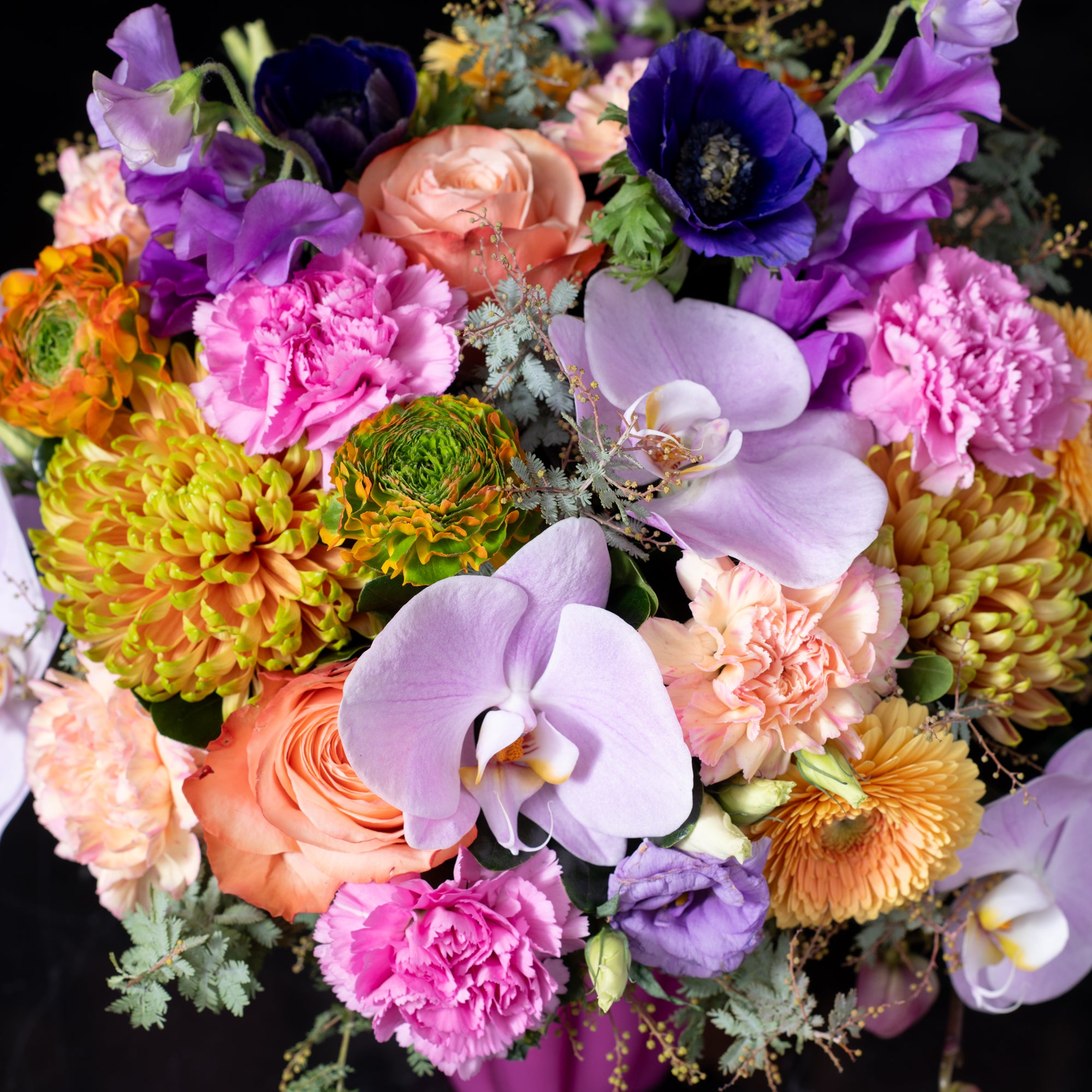 Vibrant orchid and rose bouquet with lush chrysanthemums and carnations showcasing Bloom by Anuschka s signature flower crafting artistry in Denver