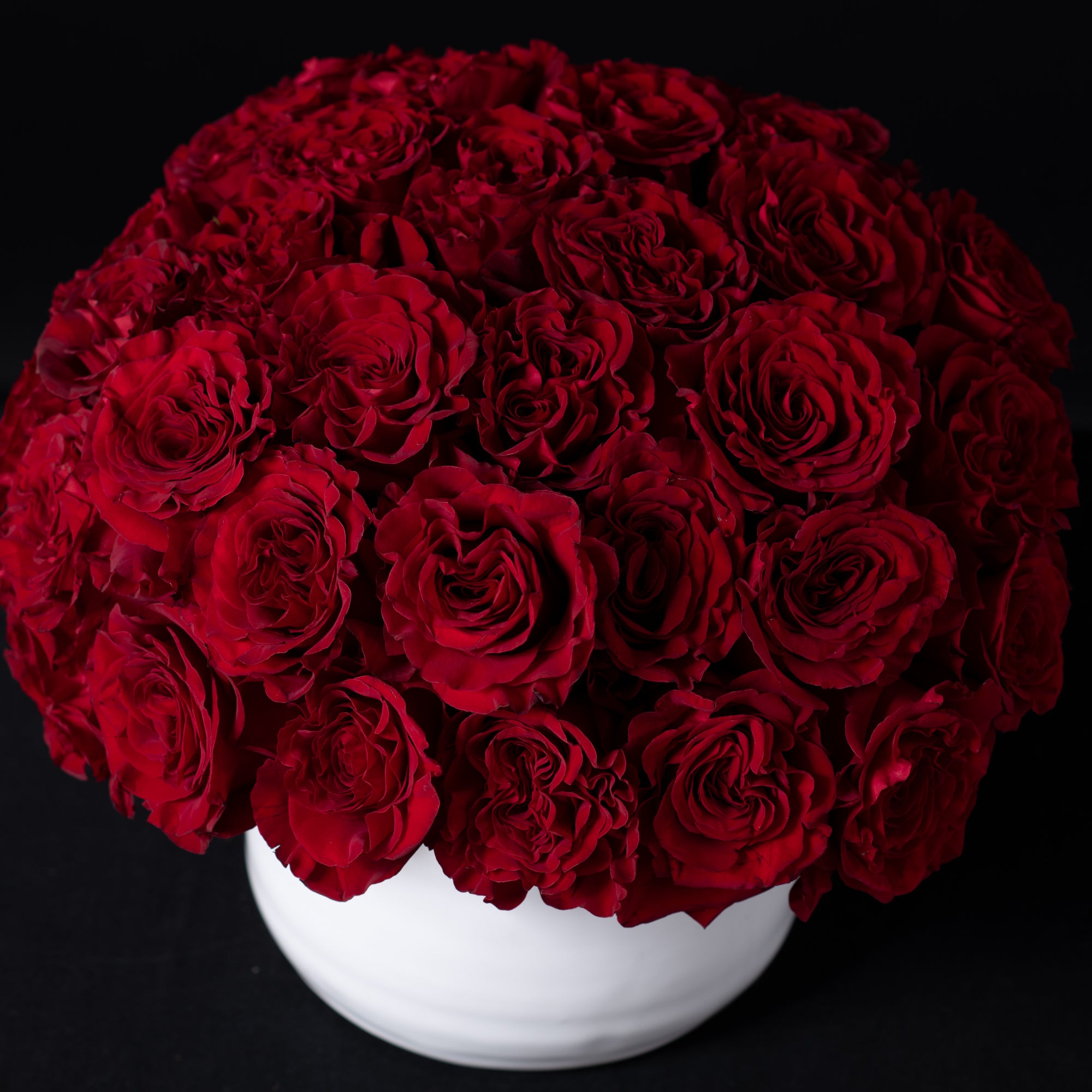 Elegant red rose floral display, perfect for romantic occasions and birthdays, showcasing Bloom by Anuschka’s expert flower crafting.