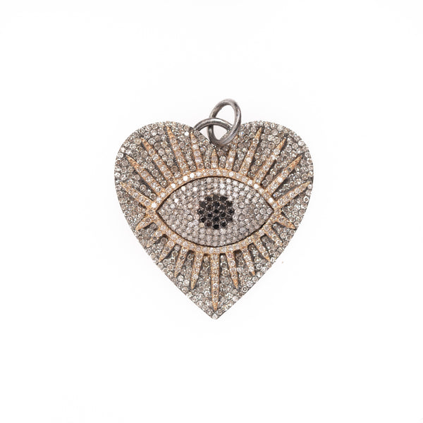 open eye on heart and silver pendant 