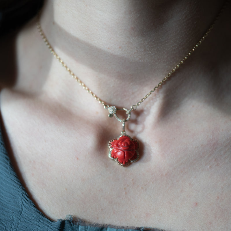 carved rose in gold with diamond pendant 