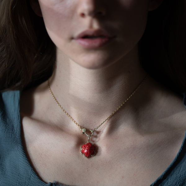 carved rose in gold with diamond pendant 