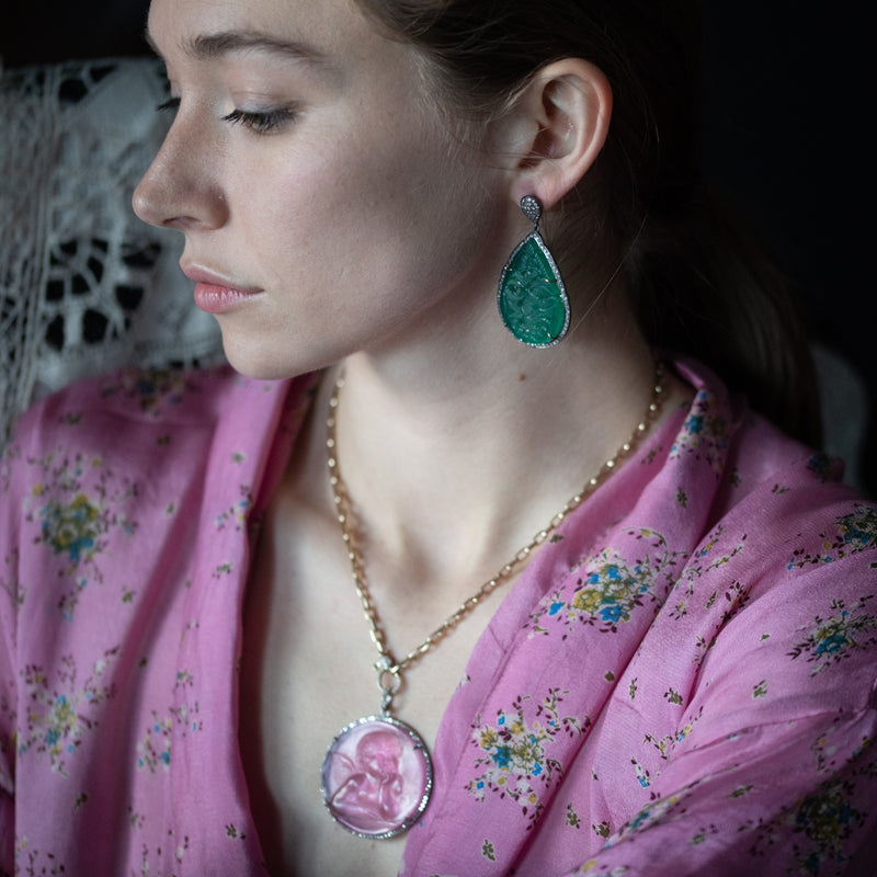 hand carved jade earrings on model
