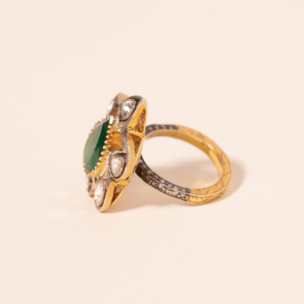 bezel set flower motif emerald and diamond ring 