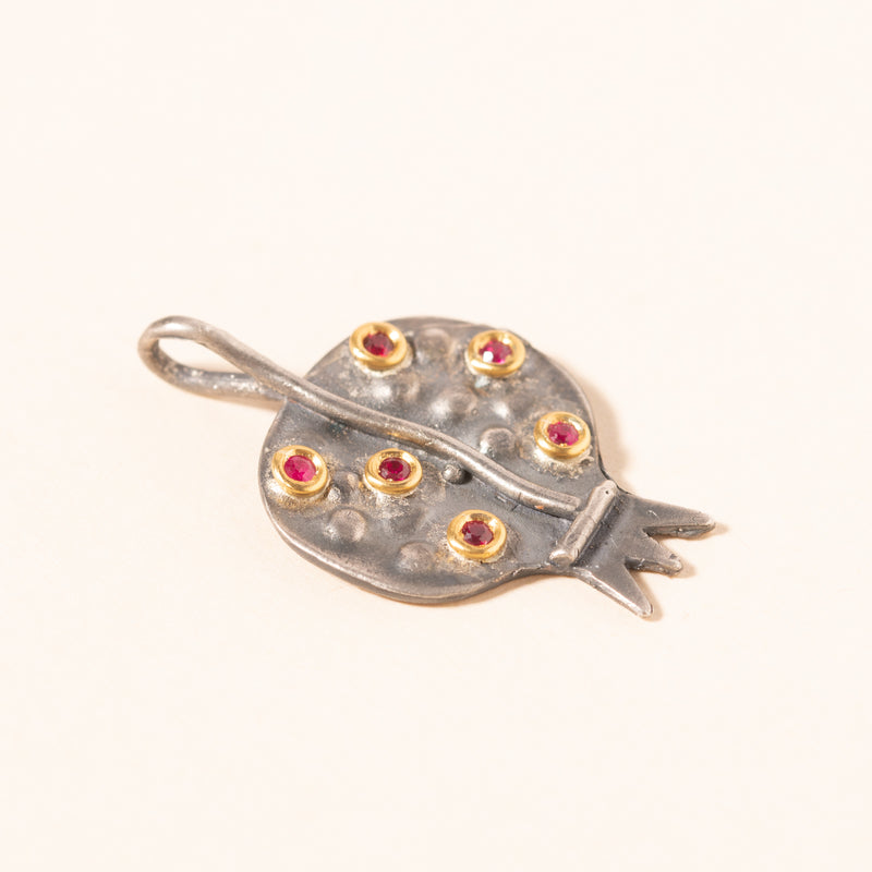 silver pomegranate pendant with rubies set in gold
