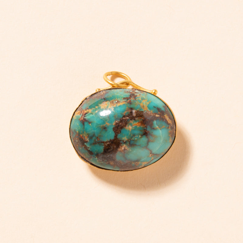 turquoise pendant set in gold