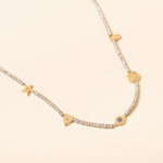 16in Silver and diamond necklace with gold hasma, star, heart, evil eye and smiley face charm