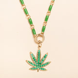 17in gold and green enamel link necklace with diamond connector