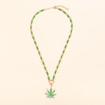 17in gold and green enamel link necklace with diamond connector