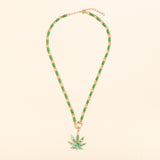 17in gold and green enamel link necklace with diamond connector