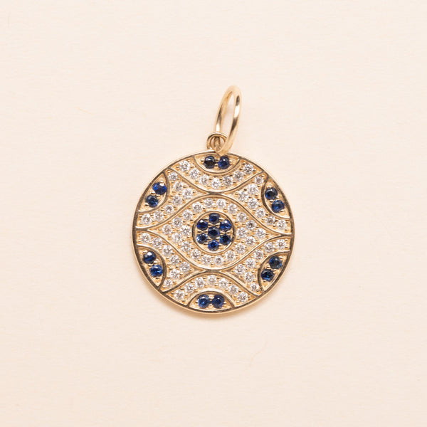 gold evil eye with diamond  and sapphires pendant 