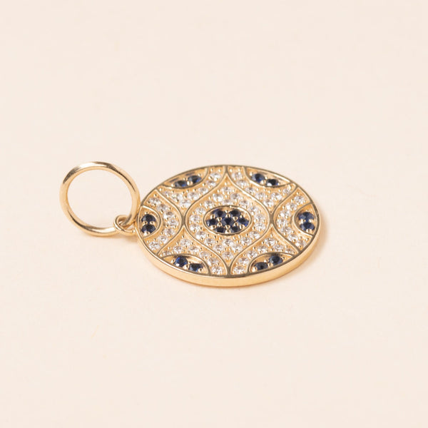 gold evil eye with diamond  and sapphires pendant 